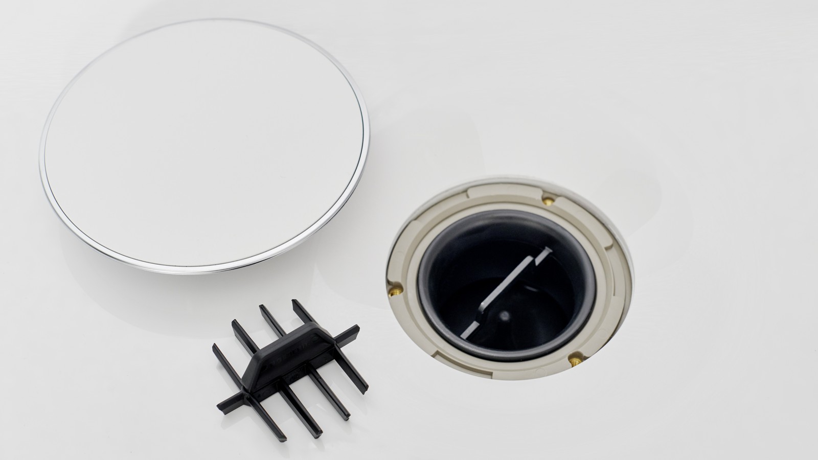 Kryt odpadního ventilu a hřebenová vložka Kryt odpadního ventilu a hřebenová vložka