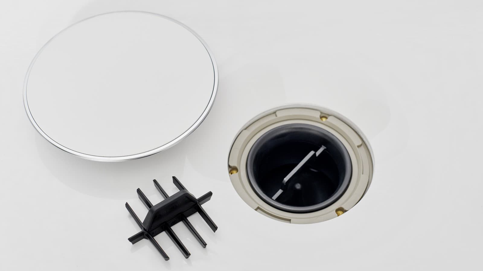 Kryt odpadního ventilu a hřebenová vložka Kryt odpadního ventilu a hřebenová vložka